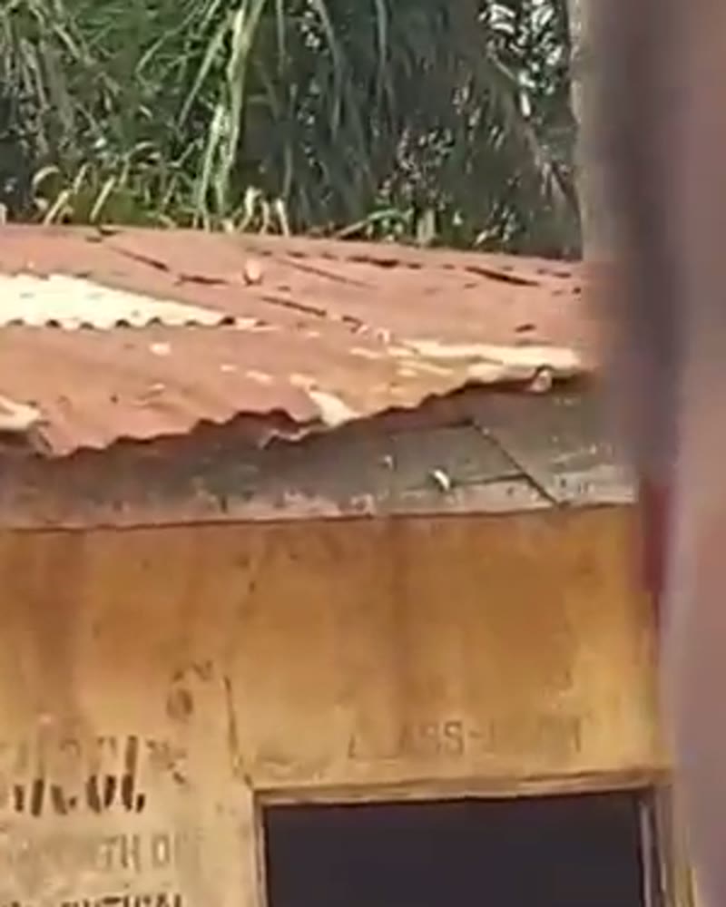 Rusted roof and cracked classroom wall of the old Nsude Primary School building