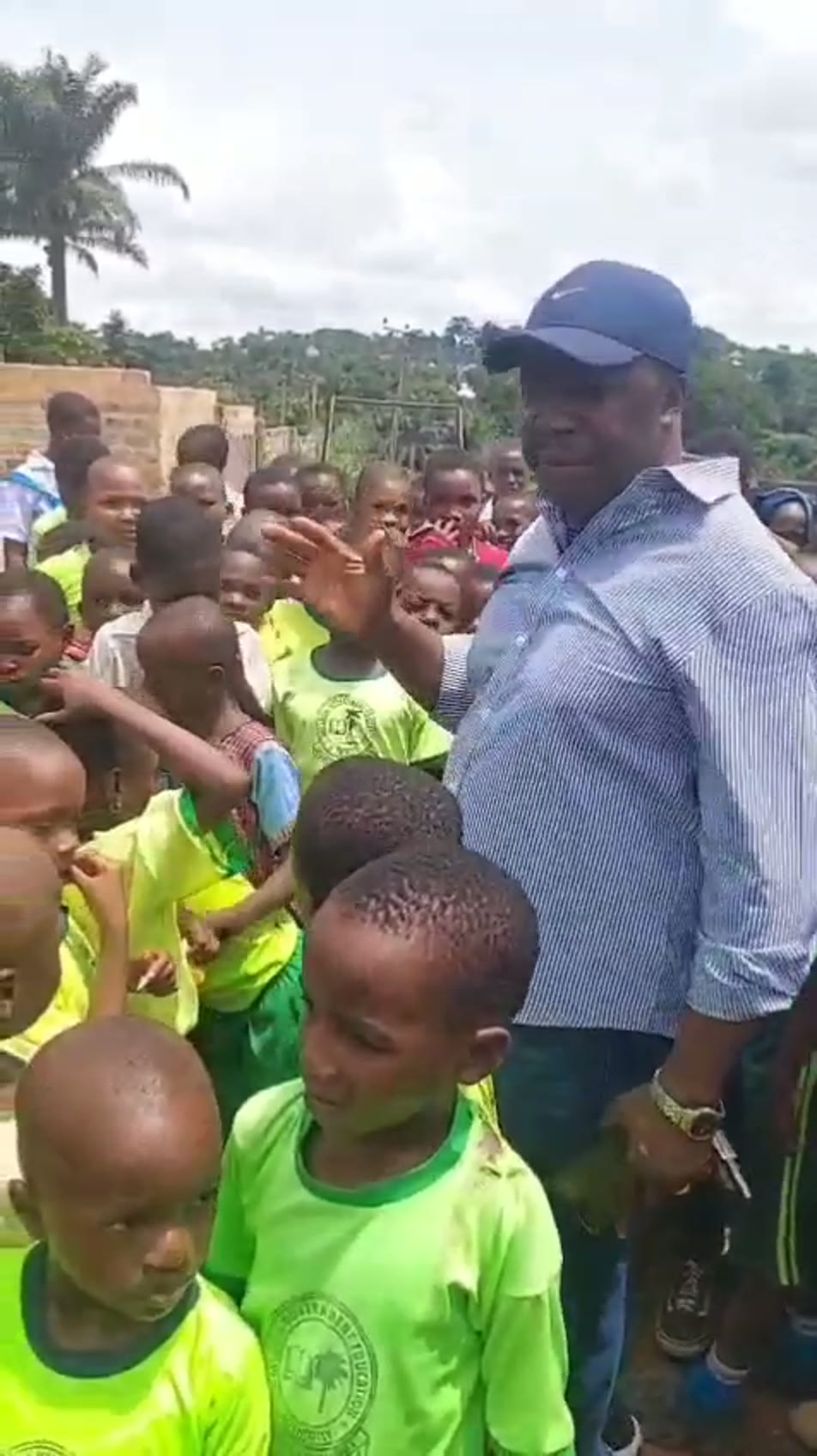 Children greeting a visitor at Nsude Primary School